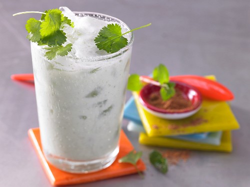 A yoghurt smoothie with lime juice, herbs and cardamon
