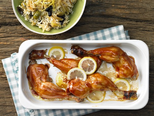 Marinated chicken legs with lemon and olive rice