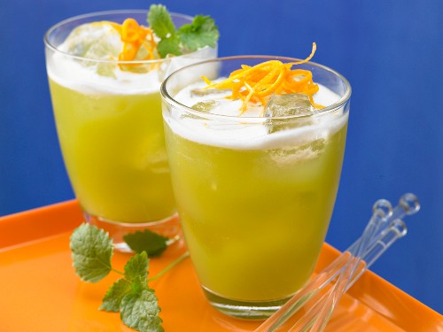 Two asparagus and melon cocktails with lemon balm
