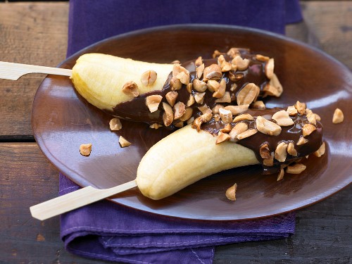 Baby banana skewers with a chocolate and peanut glaze