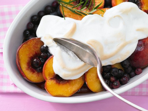 Blueberry and peach compote with maple syrup, topped with meringue