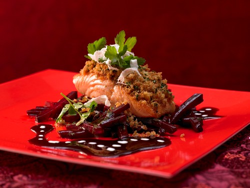A salmon fillet with horseradish breadcrumbs and a beetroot sauce
