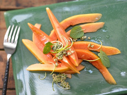 Papaya carpaccio with a lime and mint pesto
