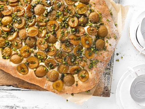A mirabelle plum cake with chopped pistachios