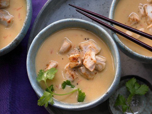 Sweet potato and coconut soup with chicken cubes