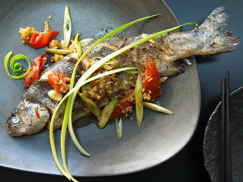 Szechuan trout with tomatoes and chili