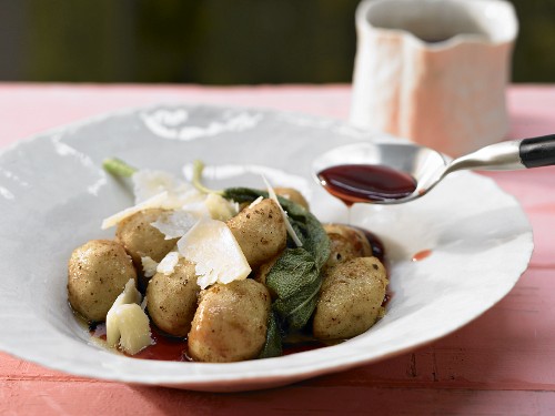 Potato gnocchi with sage, aged parmesan and red wine