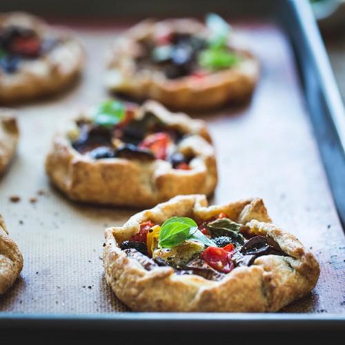 Savoury eggplant galettes with olives, tomatoes and basil