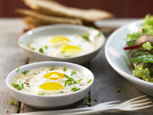 Baked quail eggs in soy cream with truffle oil