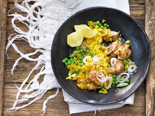 Paella with chicken and peas