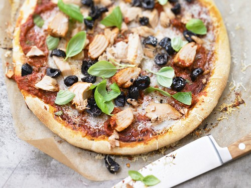 Pizza topped with tuna and olives