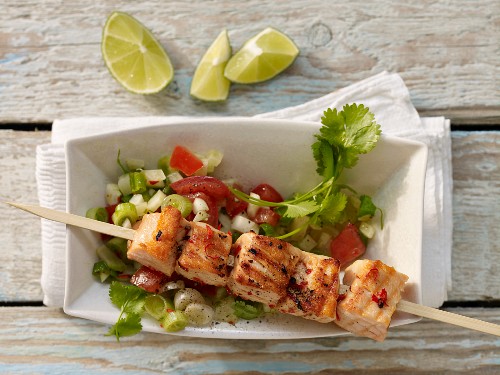 Grilled salmon skewer with fennel and tomato salsa