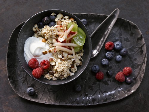 Fruity bircher muesli with apples, grapes, berries, sultanas and hazelnuts