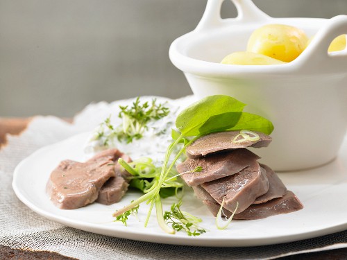 Boiled veal tongue with quark and potatoes