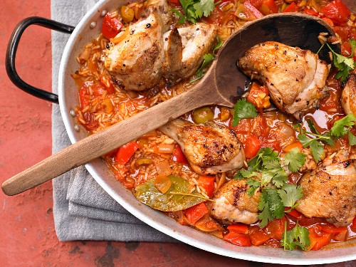 Spanish style braised rice with chicken and peppers