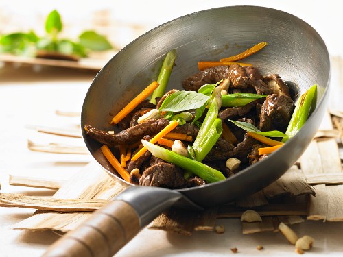 Wok-fried beef and shiitake with carrots and Thai basil