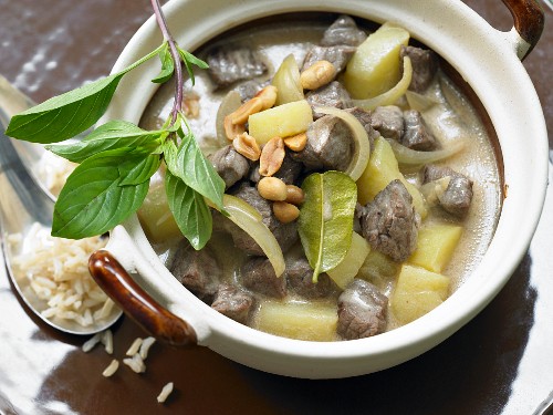 Beef curry with potatoes, coconut and peanuts