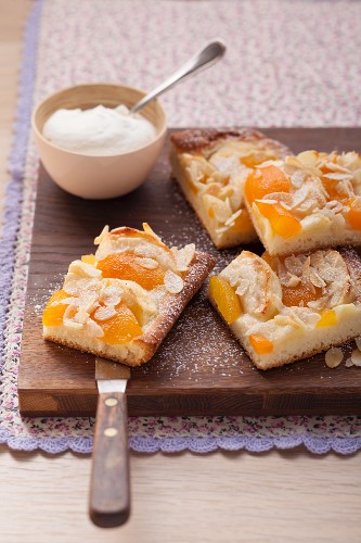 Apricot apple cake with almond flakes