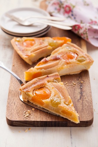 Fruit tart with apricots, pears and grapes