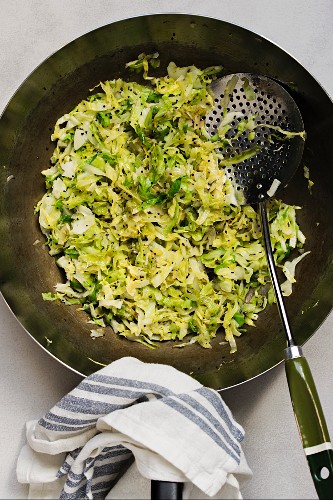 Fried spring cabbage in a wok