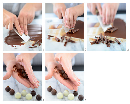 Truffle pralines being covered in chocolate