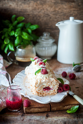 Coconut meringue roll with raspberries