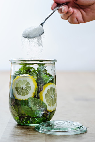 Mint syrup ingredients in a glass jar