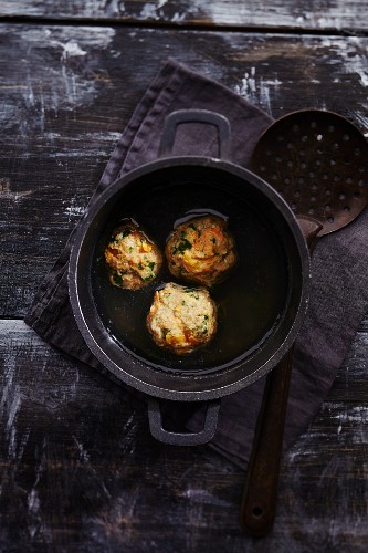 Oriental dumplings with dried apricots in broth