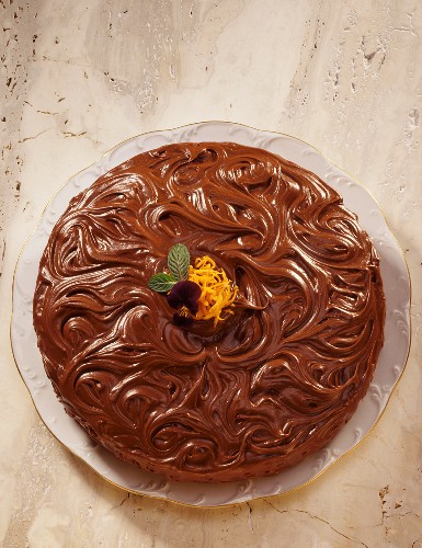 Chocolate cake with artistic chocolate glaze