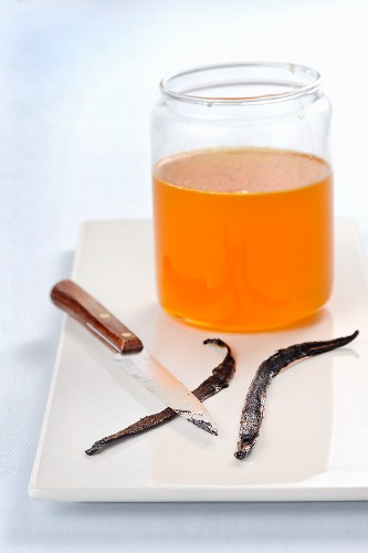 Vanilla seeds being scraped put for citrus fruit syrup