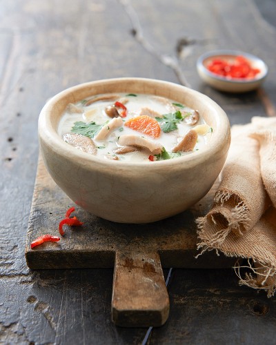 Chicken soup with coconut milk, vegetables and chilli