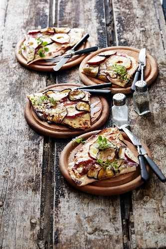 Tarte flambée with sliced apple and courgette