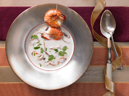 Coconut and lemongrass soup with a prawn skewer
