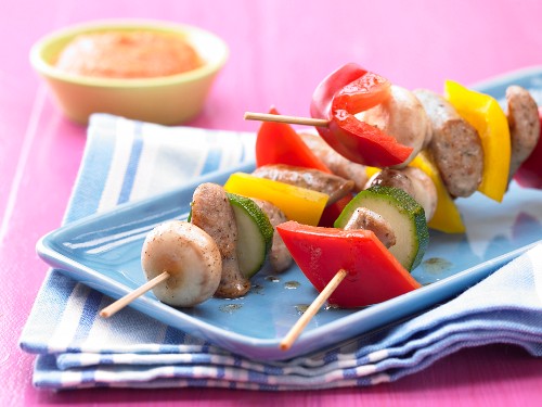 Sausage kebabs with courgette, peppers and mushrooms