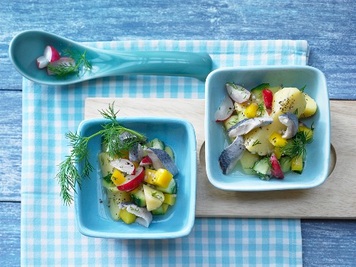 Potato and herring salad with yellow pepper, radish and a dill and mustard dressing