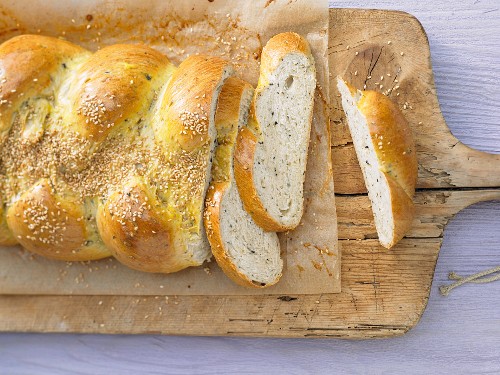 A savoury sesame seed yeast plait with olives and rosemary
