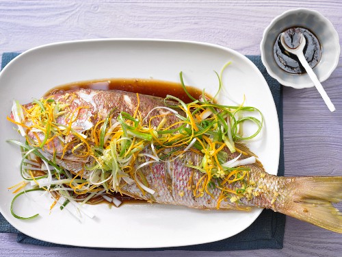 Red snapper with spring onions and orange