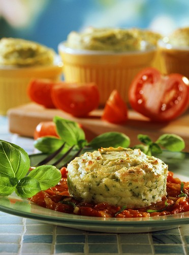 Herb potato souffle on tomato sauce