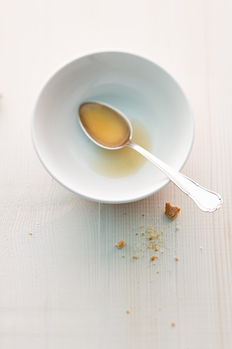 Remains of bouillon in a bowl with a spoon