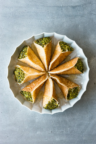 Atayef – Mini pancakes filled with pudding and pistachio nuts