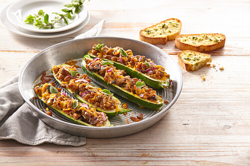 Zucchini boats stuffed with ground beef and herb crostini