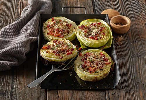 Baked cabbage with striped bacon and cheese and steps