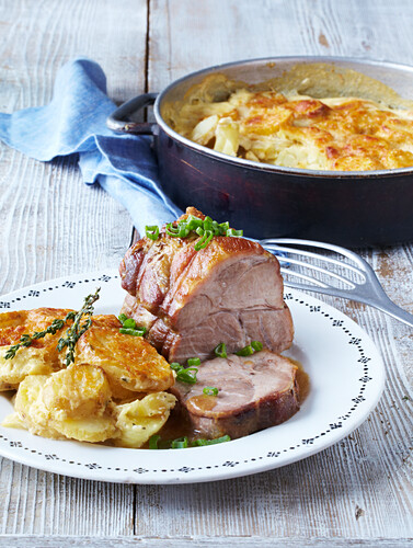 Gratinated potatoes with baked pork neck