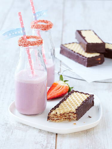 Homemade chocolate and hazelnut wafers with strawberry milk