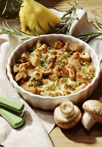Mushroom gratin with chives in baking dish