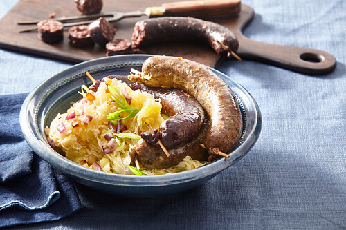 Blood sausage and white pudding with sauerkraut and potatoes