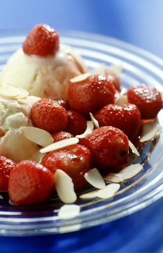Flambéed strawberries with flaked almonds & vanilla ice cream