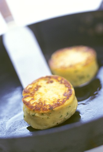Frying potato cakes (made from potato pancakes) in pan