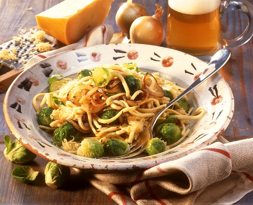 Cheese noodles (spaetzle) with Brussels sprouts on plate