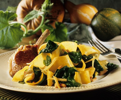 Strips of fried pumpkin with spinach, with lamb cutlet